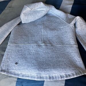 Thick zip up stretchy material. Wore once or twice